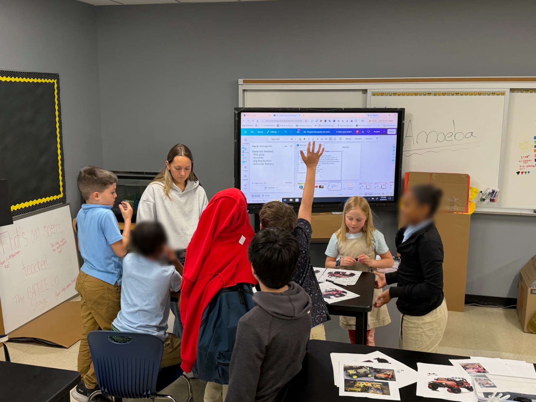 Students gathered around a smartboard during a Project STEMpathy workshop