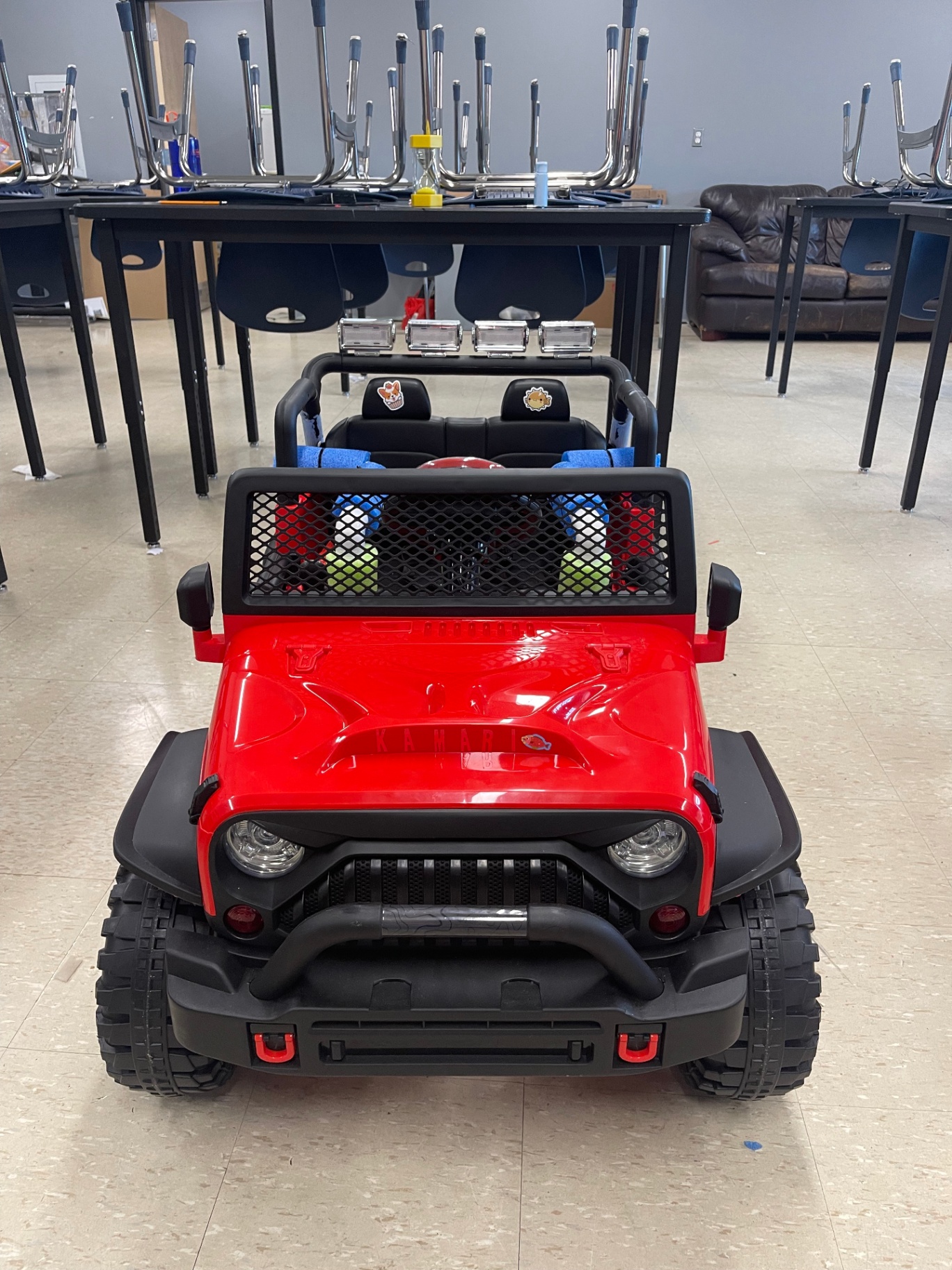 Finished red adaptive Jeep with light bar, ready for delivery
