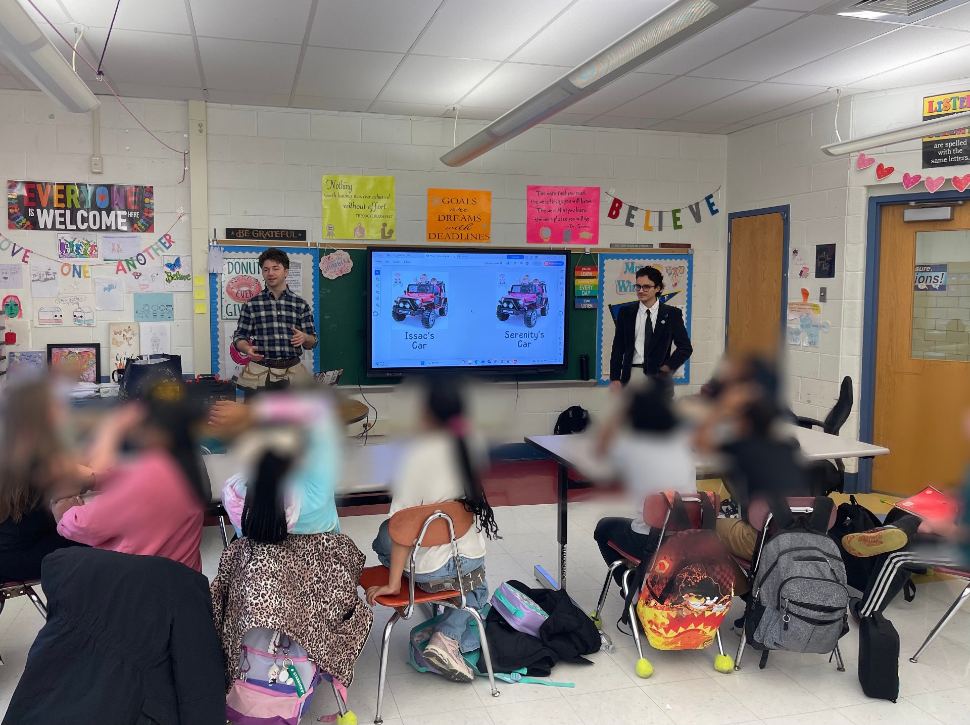 Project STEMpathy team presenting adaptive car plans to a classroom of students