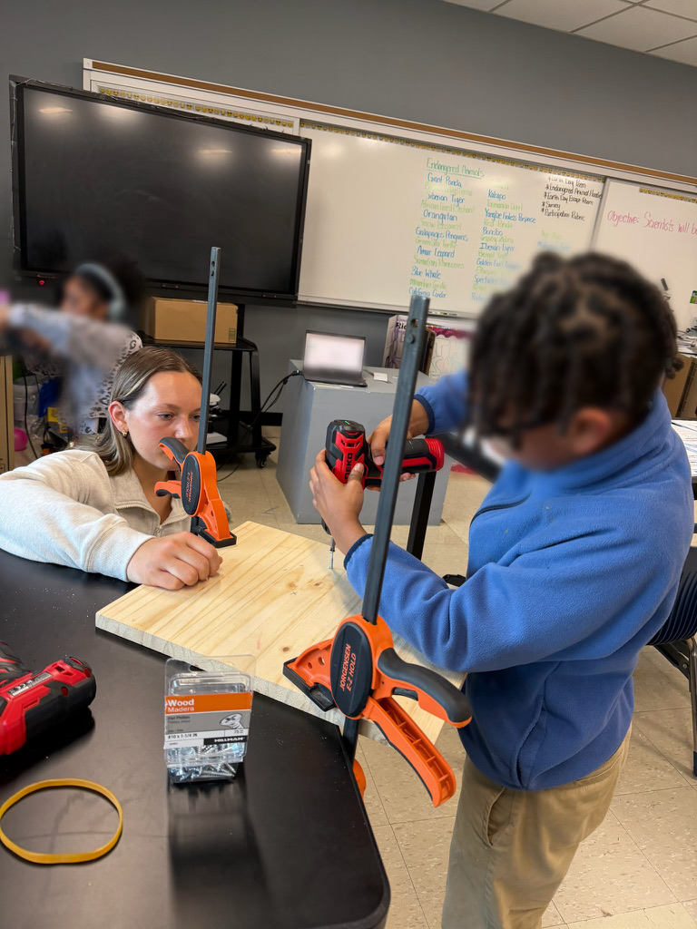 Students working together in a classroom workshop to build adaptive technologies